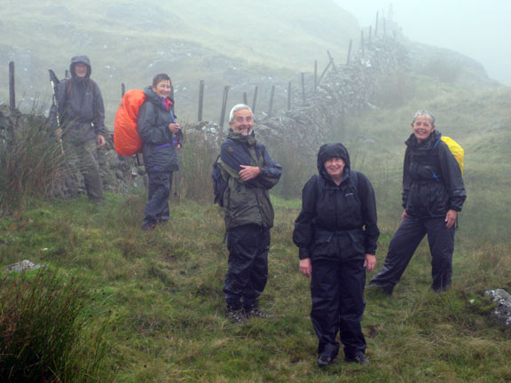 1.Rhobell Fawr & Dduallt
23/8/09. Half the group, ahead of the rest, take pleasure in posing for a photograph in the pouring rain.
Keywords: Aug09 Sunday Judith Thomas