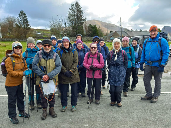 1. Mynydd Mawr
5/4/26. On the roadside parking area at Y Frôn. The mountain that we are to climb can be seen far away in the background. Photo: Eryl Thomas.
Keywords: Apr26 Sunday Noel Davey