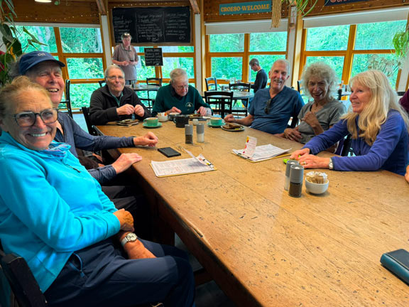 9. Llyn Padarn Circuit
2/7/26. Caffi Caban. One large table was able to take us all with a bit of subtle chair maneuvering. Not a Victoria Sponge in sight! Photo: Judith Thomas.
Keywords: Jul26 Thursday Caroline Woodward