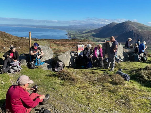 4. Three Peaks of Yr Eifl
18/10/26. The welcome panad at Bwlch y r Eifl. There is quite a chilly breeze. Photo: Noel Davy.
Keywords: Oct26 Sunday Gareth Hughes